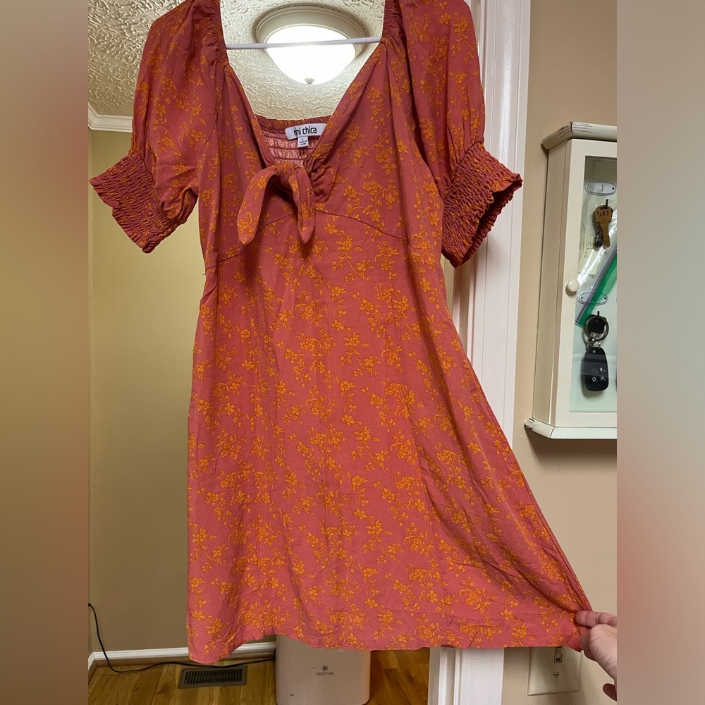 Peach and orange flower print summer dress with pockets. Size large.